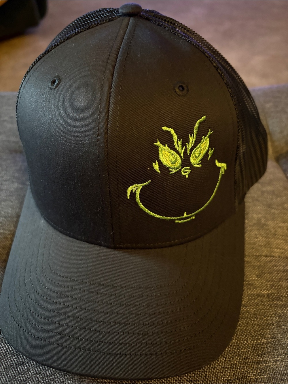 Black Trucker Hat with Neon Green Grinch Smile Embroidery